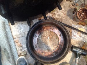 Brake drum gets a coat of copper grease on the rim.